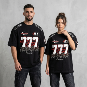 Front view of a male and female model styling matching black unisex oversized streetwear t-shirts featuring a bold white "777 Race Team" chest graphic, red checkered patterns, and "CHICAGO" printed along the drop-shoulder seams.
